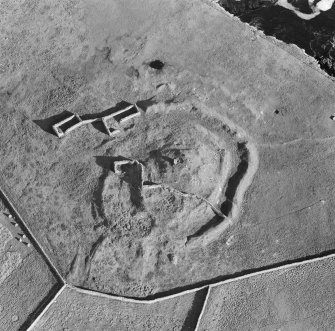 Oblique aerial view centred on the remains of the broch at Dalsetter.

