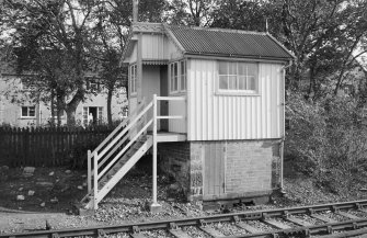View of south signal box, Brora Station, from opposite side of railway track.