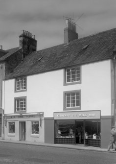 View of 10 and 11 Shore street, Anstruther Easter, from S, showing D E Shoe Service and Kilrenny T T Milk Bar.