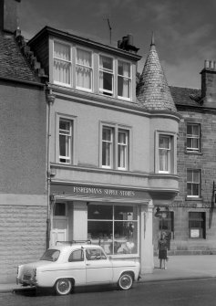 View of 13 Shore Street, Anstruther Easter, from S, showing the Fisherman's Supply Stores.