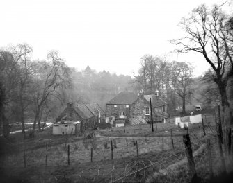 General view from S also showing cottages.