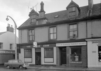 View of 16-18 Glasgow Street, Ardrossan, from NW, showing the Horse Shoe bar and The City of Glasgow Friendly Society.