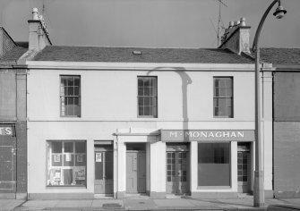 View of 13-17 Princes Street, Ardrossan, from SW, showing the premises of M Monaghan.