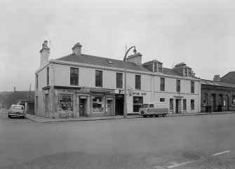 View of 61-69 Princes Street, Ardrossan, from SW, showing H Reid general store and Winton Bar.