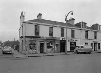 View of 61-69 Princes Street, Ardrossan, from SW, showing H Reid general store and Winton Bar.