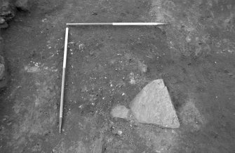 Excavation photograph : square clay/soil feature, from E.