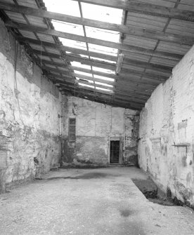 Interior. View from NE of SE end of lean-to area at NE side of warehouse ('Room 4')