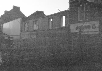 Excavation photograph: location shot
General view from N showing High Street front

