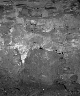 Interior.
Detail of slab built into the base of the N wall of the W apartment of the dwelling-house.