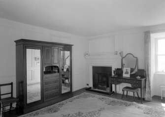 Interior view of Wedderlie House showing first floor bedroom with fireplace.