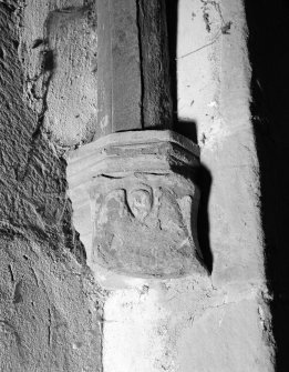 Interior view of Towie Barclay Castle showing corbel with shield with emblems of evangelist in gallery of Great Hall.