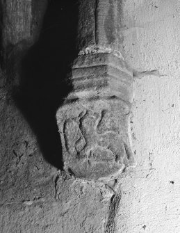 Interior view of Towie Barclay Castle showing corbel with shield with emblems of evangelist in gallery of Great Hall.