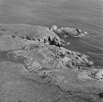 Oblique aerial view of the remains of Levenwick broch.