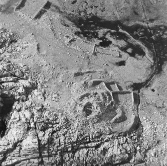Oblique aerial view of the remains of Levenwick broch.