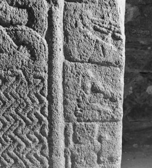 Detail of cross-slab at Ardchattan, showing musicians and warrior on the right of the cross-shaft on face A.
 
