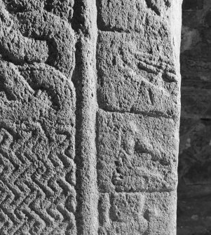 Detail of cross-slab at Ardchattan, showing musicians and warrior on the right of the cross-shaft on face A.
 
