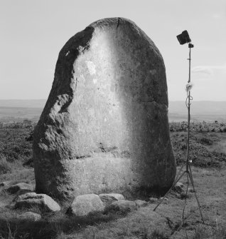 View of standing stone with small incised cross at Fowlis Wester showing camera and flash set up.
 
