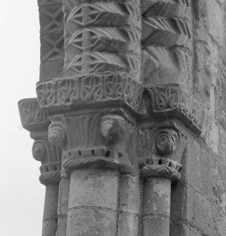Detail of the carved capitals on the left-hand side of the arch between the chancel and apse of the medieval church at Tyninghame.
 
