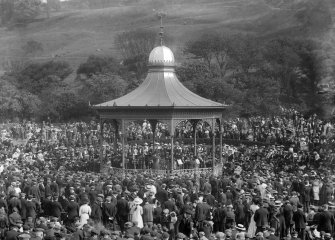 View of the Ross Bandstand, Princes Street Gardens, Edinburgh, showing orchestra and spectators.