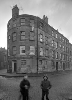 View of the corner of 13 Henry Street and 1-18 Parkside Street, Edinburgh, from NE.