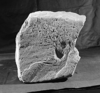 View of incised stone gaming board from Whithorn.