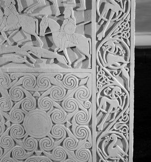 Detail of the vine scroll on the modern reconstruction sculpture by Barry Groves, representing face C of the cross-slab found at Hilton of Cadboll. The modern version stands close to the chapel site.
 
