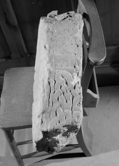 View of narrow face of fragment of Pictish carved stone in the parish church at Forteviot.