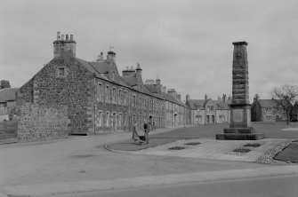 General view of 1-20 Greenside and the war memorial, Leslie, from S.