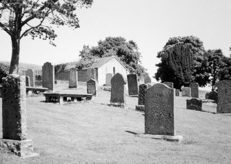 General view of churchyard and burial aisle.