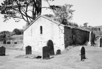 General view of churchyard and burial aisle.