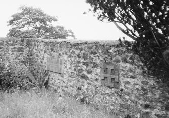 View showing memorial plaques in wall.