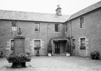 View inside courtyard showing stables converted to residences.