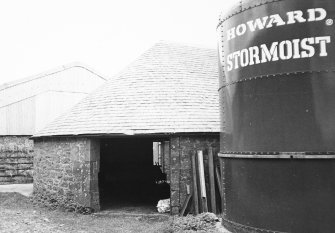 View of horsemill with adjacent silo from N.