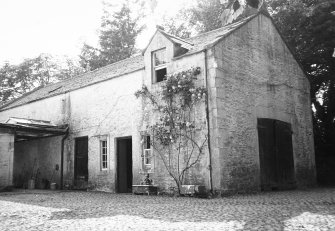 View of outbuilding from NE.