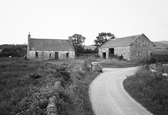 General view of farm cottage and barn from N.