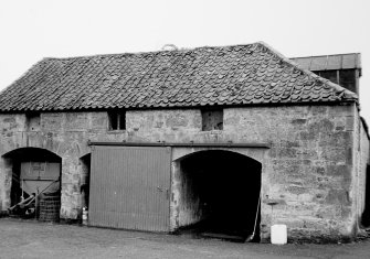 View of barn with flat arched entrances and pantiled roof