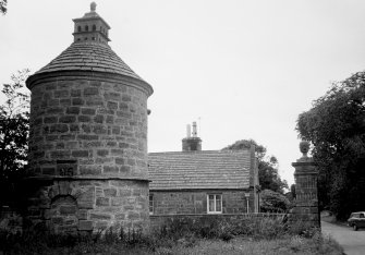 View of one gatepier and dovecot with East Lodge in the background