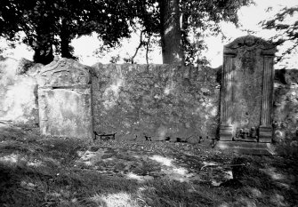 Headstones set into Churchyard wall