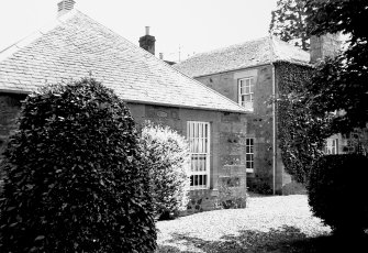 Part of farmhouse and rear of Smithy