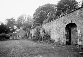 Garden walls and distant view of Cottage