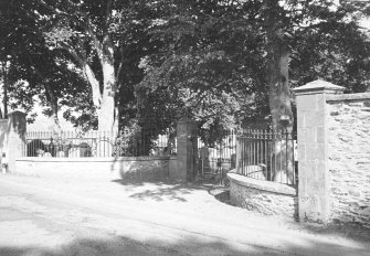 General view from road showing entrance gates to churchyard.