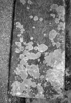 Detail of inscription on gravestone.