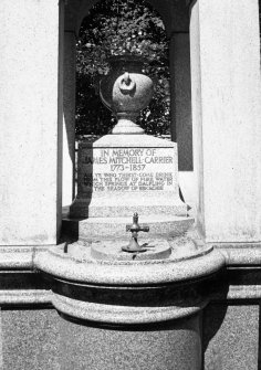 Detail of pedestal, with urn and water faucet.