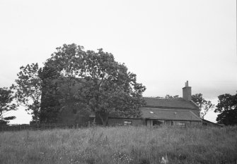 View of farmhouse rear elevation.