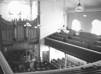 Interior.
View of preaching hall from centre gallery to pulpit and organ.