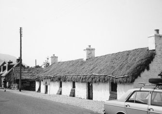 Photograph showing general view of cruck-framed cottage, now a folk museum; Glencoe.