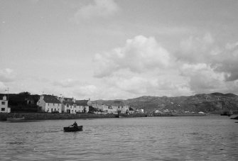 Skye, Kyleakin, Harbour.
General view with man in a rowing boat.