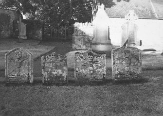 View of four tombstones.