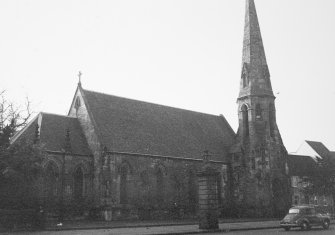 General view of gate piers and St Peters from N.