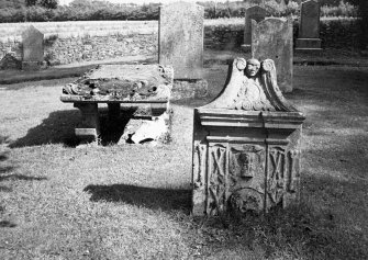 View of tombstone and tablestone.